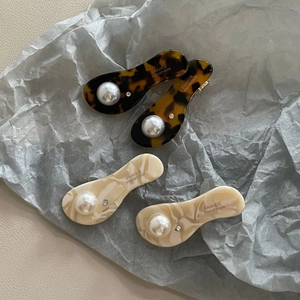 Elegant acetate oval hair clips with pearls and rhinestones in tortoise and cream patterns