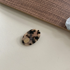 French retro oval tortoiseshell acetate hair clip with vintage gold metal logo plaque