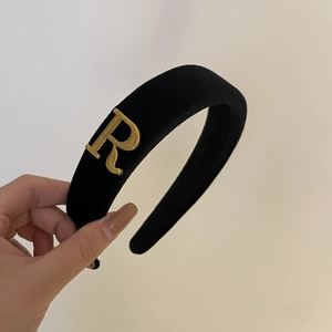 Elegant wide black velvet headband featuring a vintage gold metal letter R accent