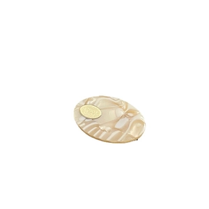 French vintage oval acetate hair clip with marble texture and golden metal inlay detail