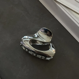 Minimalist metallic heart hair claw clip in polished silver finish for hair styling