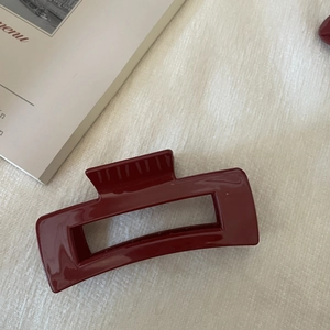 Elegant deep red oversized shark hair claw clip with a glossy hollowed-out rectangle design