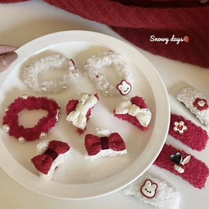 Plush bunny hair accessories set with red and white scrunchies and festive bow clips