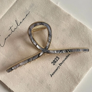 Large marble grey acetate hair claw clip with golden metal frame for thick hair