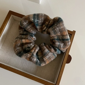 Retro plaid scrunchie in brown and grey fabric for autumn hairstyles and headbands