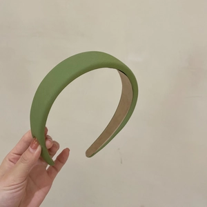Solid avocado green faux sheepskin headband with a padded high-top design for women