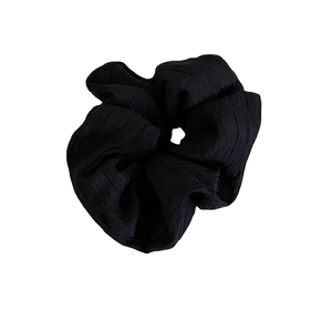 Classic black scrunchie with French pleated texture and ribbed fabric design for women