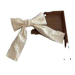Elegant white pleated headband with pearl trimming and floral jacquard texture