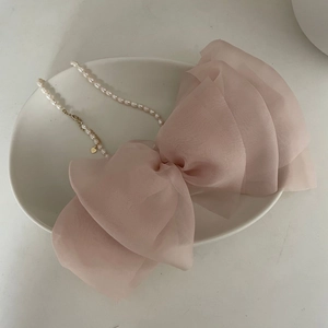 Elegant pink mesh double layered bow hair clip with faux pearl chain and gold heart charm