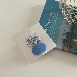 Blue vintage floral and textured fabric hair clips set on white display card