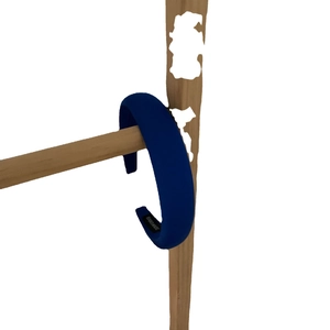 Deep blue wide padded headband made of textured fabric with handmade label details