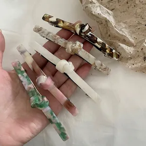 Five-piece acetate knotted hair clip set in tortoiseshell and marble patterns