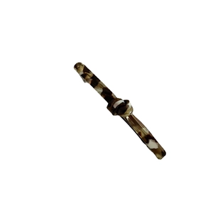 Elegant tortoiseshell acetate hair clip with knot design and silver metal clasp base