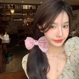 Elegant large pink satin bow hair clip for women with premium glossy silk texture