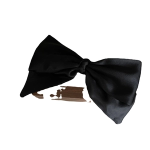 Elegant oversized black satin bow hair clip with a smooth glossy finish for women