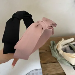 Satin bow headband set for women in macaron colors like black, pink, green, and cream