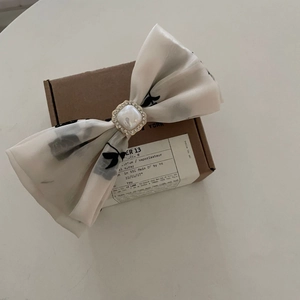 Elegant white floral chiffon bow hairband with black rose patterns and pearl centerpiece