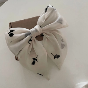 Off-white floral bow hair scrunchie with black tulip print on lightweight chiffon fabric