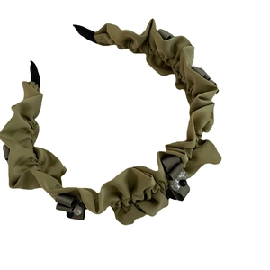 Olive green pleated fabric headband with small grey bows and beaded crystal accents