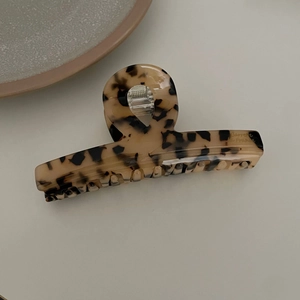 French leopard print acetate hair claw clip with large crisscross design for women