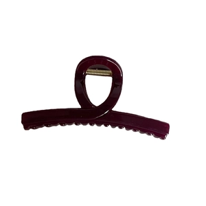 Minimalist jelly burgundy hair claw clip with sleek twist design on white background