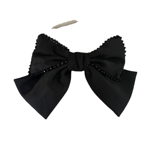 French style black satin bow hair clip with crystal bead embellishments on white background