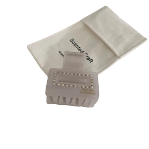 French style lavender acetate shark clip with crystals and a white drawstring storage bag