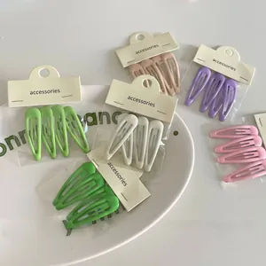 Detail showing macaron color metal hair clips set on paper card packaging