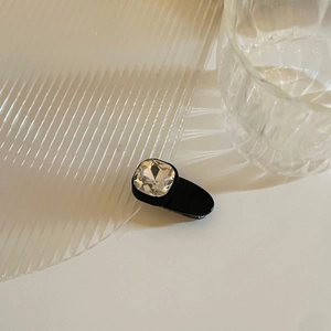 Elegant black hair clip with a large faceted clear crystal for women and girls