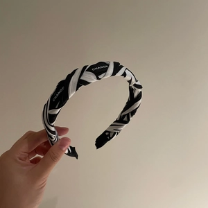 Minimalist black and white striped headband with CHANGE letter print for women