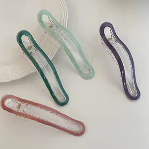 Set of four colorful macaron acrylic hair clips in green, purple and pink shades