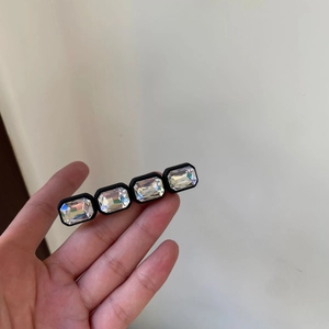 Elegant hair clip featuring rectangular clear crystals in a sleek black metal frame