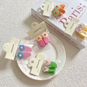 5-pair set of sweet floral hair clips for girls in matte pastel colors on display