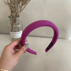 Close-up of handmade thickened magenta fabric headband featuring soft sponge filling