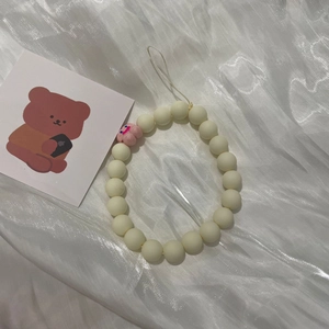 Korean style macaron beaded phone charm with white matte beads and pink smiley flower