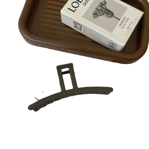 Morandi matte brown acrylic long hair claw clip displayed on a minimalist background