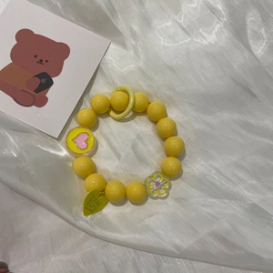 Charming yellow macaron bead bear phone strap with heart and flower pendants