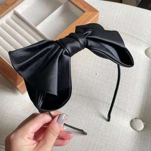 Elegant black satin double bow headband for women featuring high-quality silky texture