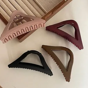 Set of four matte large triangle hair claw clips in pink, red, black, and coffee colors