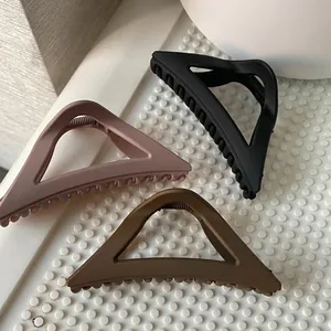 Three-piece matte triangle hair claw clips in black, pink and coffee for women styling