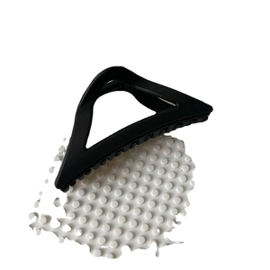 Minimalist matte black triangular claw clip for hair with geometric hollow design