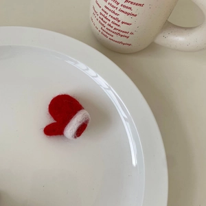 Fermaglio per capelli a guanto di Natale in feltro di lana fatto a mano rosso e bianco
