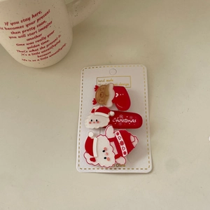 Three-piece Christmas themed hair clip set featuring Santa Claus and acrylic lettering