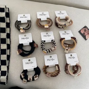 9-piece set of Korean style elastic hair ties in neutral autumn tones and plush textures