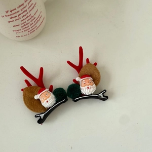 Detail of Christmas duckbill clips with Santa Claus, reindeer antlers and plush ears