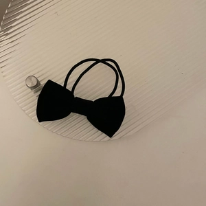 Elegant black flocked fabric bow hair clip with pearl accents for women and girls