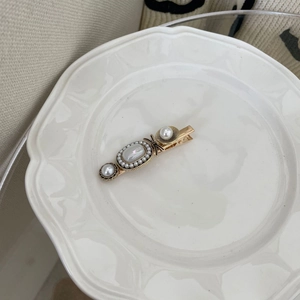 French INS style duckbill hair clip with pearls and golden iridescent gemstone accents