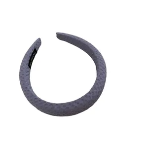 Gray-purple waffle texture headband with handmade label on white background