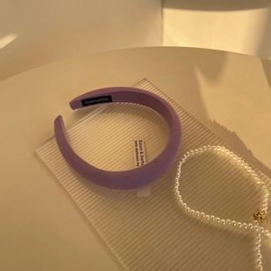 Padded purple knit headband with handmade label and pearl accents for girls