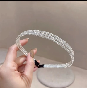 Elegant Korean style three-row pearl headband with a black fabric wrapped base for women